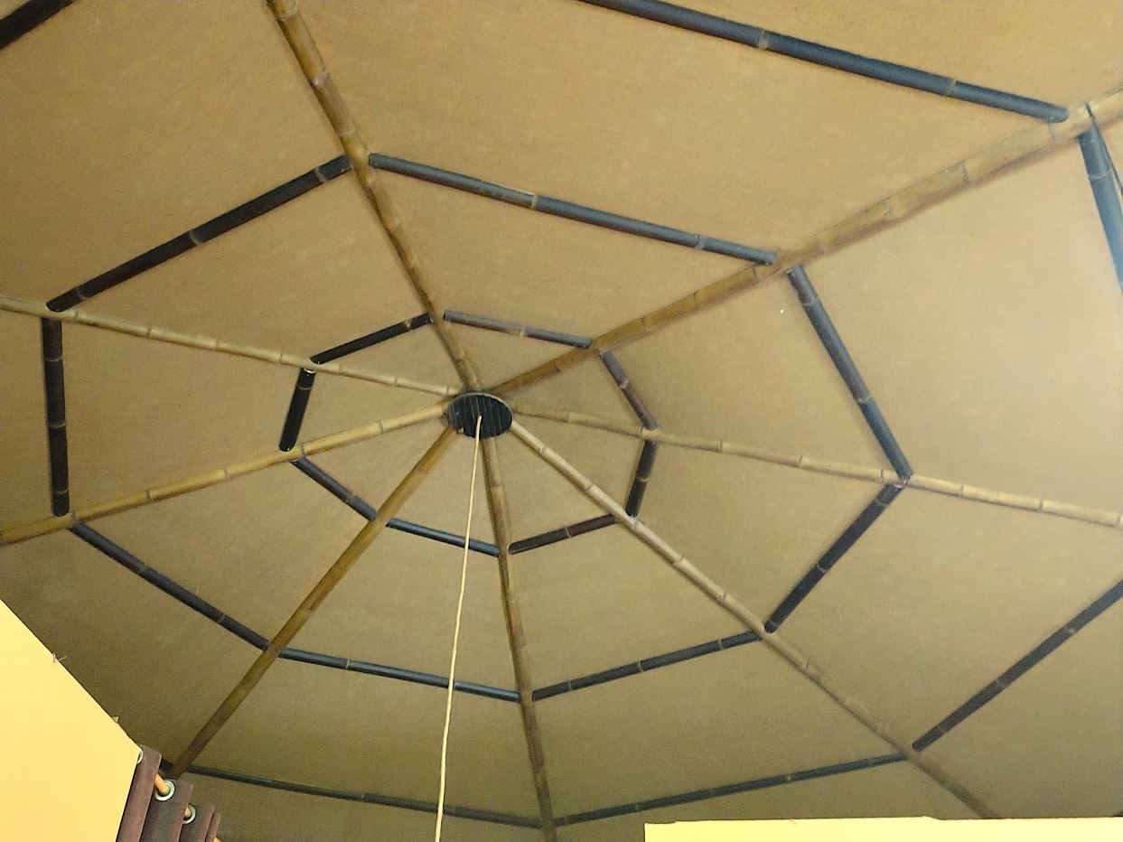Interior ceiling with a bamboo spoke framework forming a geometric, tent-like dome