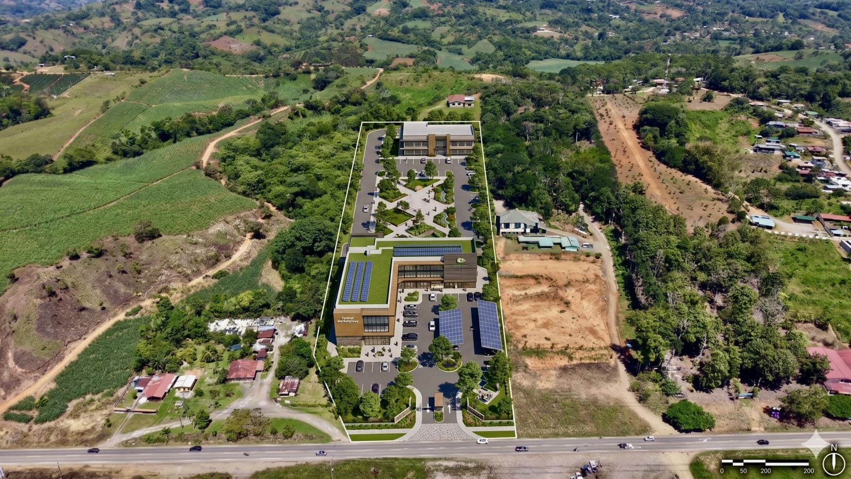 Aerial rendering of a long rectangular development site with a modern two-story building, parking, and landscaped courtyards surrounding it.